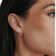 Our gemstone earrings are impeccably crafted. Set in 18K white or yellow gold, they feature regal red oval-cut Rubies intricately encompassed by a halo of round brilliant-cut Diamonds. Add an extravagant yet subtle splash of color to any ensemble! This piece really pops when paired with other rubies from our Gemstone Collection. Natural Rubies: 1.30ctw Natural Diamonds: 0.20ctw 18K White or Yellow Gold Length: 1.5 Inches Ruby Halo Earrings In Fine Jewelry Style, Oval Ruby Earrings With Halo Design, Ruby Earrings With Halo Setting, Red Ruby Earrings With Halo Setting, Ruby Halo Earrings, Diamond Halo Earrings, Halo Diamond Earrings, Gemstone Collection, Halo Earrings