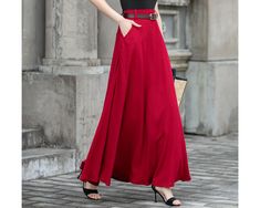 Crafted from premium linen fabric, this skirt offers a combination of comfort and sophistication. The high-waisted design accentuates your waistline, creating a flattering silhouette. The swing style adds a playful and feminine touch, allowing for effortless movement and flow. Whether you're going for a casual day out or dressing up for a special occasion, this red linen skirt is a versatile and timeless addition to your wardrobe. DETAIL * 50% linen , 50% cotton * High waisted skirt * Two side p Flowy Full-length Skirt With Pockets, Full-length Flowy Skirt With Pockets, Full Length Flowy Skirt With Pockets, Relaxed Maxi Skirt With Pockets, Full-length Relaxed Skirt With Pockets, Relaxed Full-length Skirt With Pockets, Long Red Skirt With Pockets, Red Maxi Skirt With Pockets For Spring, Red Skirted Bottoms With Pockets