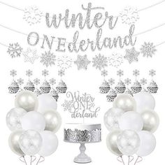 some white balloons and snowflakes are in front of a sign that says winter wonderland