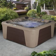 a hot tub sitting in the middle of a yard