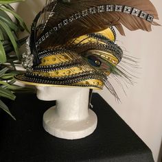 Donna Vinci Couture Yellow Embellished Hat With Feathers New With Tag One Size Fits Most Has An Adjustable Band For Sizing 100% Polyester See Photos For Details Please Note Missing Feathers In Photos 6 And 10 Elegant Fitted Carnival Headpiece, Traditional Carnival Costume Hats And Headpieces For Party, Designer Curved Brim Hats For Parties, Kentucky Derby Party Hat Embellished, Kentucky Derby Party Embellished Hat, Party Hats With Bead Caps, Elegant Costume Hats And Headpieces For Mardi Gras Party, Church Dress, Couture Accessories