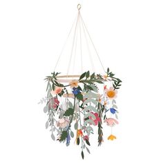 a mobile with flowers and leaves hanging from it