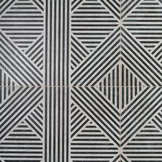 black and white tiles with lines on them