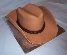 Cowboy Hat Cake. There are any references about Cowboy Hat Cake in here. you can look below. I hope this article about Cowboy Hat Cake can be useful for you. Please remember that this article is for reference purposes only. #cowboy #hat #cake Fondant Cowboy Hat, Cowboy Hat Cake Topper, Make A Cowboy Hat, Cowboy Hat Cake, Western Theme Cakes, Cowboy Birthday Cakes, Man Cakes, Cowgirl Cakes, Grandad Birthday