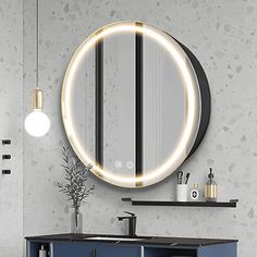 a bathroom with a round mirror above the sink