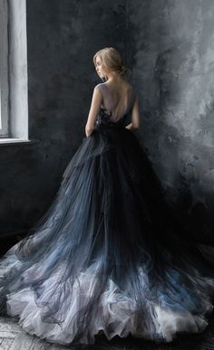 a woman in a black wedding gown with the words 26 black wedding gowns