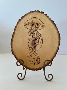 a wooden plate with a drawing on it