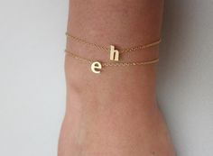 tiny gold letter bracelet Trendy Gold Name Bracelet As Gift, Trendy Gold Name Bracelet For Gifts, Trendy Hypoallergenic Gold Bracelet As A Gift, Trendy Initials Bracelet For Gifts, Gold Name Charm Bracelet As Birthday Gift, Gold Name Charm Bracelet For Birthday, Gold Charm Bracelet With Name For Birthday, Gold Charm Bracelet For Birthday Gift, Simple Adjustable Gold Bracelet For Gifts