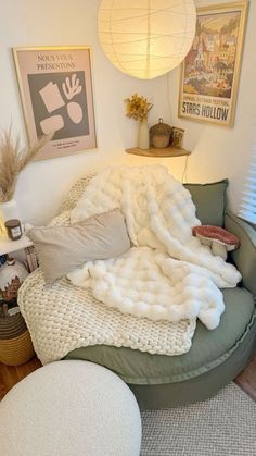 a bed with blankets and pillows on top of it