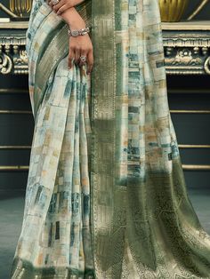 Introducing our exquisite off-white and green cotton saree, a harmonious blend of traditional elegance and modern sophistication. This saree is meticulously crafted with intricate digital printwork that adds a contemporary flair to its classic design. The rich weaving pallu and the intricately designed weaving border enhance its regal appearance, making it a timeless piece suitable for any occasion. The soft cotton fabric ensures maximum comfort, allowing you to drape it effortlessly and elegant White Semi-stitched Saree With Printed Motifs, White Digital Print Saree For Wedding, White Cotton Silk Saree With Printed Border, Green Cotton Dupatta With Digital Print, Festive White Saree With Printed Motifs, Traditional Saree With Digital Print For Eid, Green Unstitched Digital Prints With Printed Motifs, Unstitched Green Digital Prints With Motifs, Green Unstitched Digital Prints With Motifs