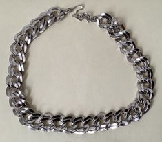 "Monet silver plated link chain necklace  Adjustable - 19\" - 20.5\" with hook clasp  Hook marked: copyright symbol Monet  Very good to excellent condition  07/18/23 1342" Trendy Silver Curb Chain Necklace, Silver Necklace With Chunky Cuban Link Chain, Trendy Silver Necklace With Curb Chain, Trendy Silver Cuban Link Necklace, Trendy Silver Cuban Link Necklaces, Silver Metal Chain Necklace With Lobster Clasp, Metal Curb Chain Necklace, Trendy Silver Necklace For Formal Occasions, Silver Snake Chain Necklace With Lobster Clasp