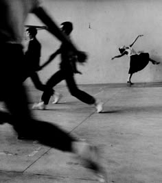 black and white photograph of skateboarders doing tricks