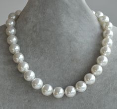 I make the necklace to use 14mm glass pearls.You can select the length when you order.IT is good necklace for your great wedding. I can make different type necklace to your requirements,Please feel free to contact me if you have any question. Thank you so much. . Fake Pearl Necklace, Huge Pearl Necklace, Vintage Bridal Necklace, Big Pearl Necklace, Statement Necklace Wedding, Large Pearl Necklace, Ivory Pearl Necklace, Simple Pearl Necklace, Grey Pearl Necklace