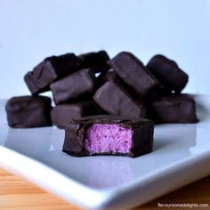 a plate that has some kind of cake on it with purple frosting in the middle