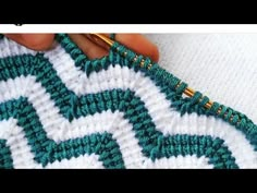 someone is crocheting the stitchs together