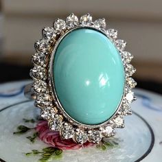 Size: 5 US 49 EU (FREE RESIZING) Metal Type: 18k white gold Weight: 16.6 grams Diamonds weight: 1.20 ct. Color:H Clarity: VSI Natural turquoise: 15mm x 19mm Condition: excellent  Introducing our Vintage 1960s sky blue turquoise and 1.20 ct. Diamond 18k Solid White Gold Statement Ring- a perfect blend of vintage charm and modern elegance. This ring is meticulously crafted from 18k solid white gold, ensuring a timeless appeal and lasting durability. The ring features a beautiful soft blue turquois Luxury Vintage Blue Turquoise Ring, Formal Oval Turquoise Ring With Diamond, Oval Diamond Turquoise Ring For Formal Occasions, Oval Turquoise Ring With Diamond Accents, Oval Turquoise Diamond Ring For Wedding, Oval Turquoise Ring With Diamond Accents For Anniversary, Oval Turquoise Ring With Center Stone For Anniversary, Luxury Silver Turquoise Ring With Oval Shape, Luxury Silver Ring With Turquoise Oval Gemstone