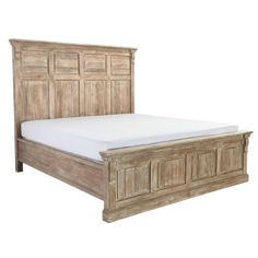 the bed frame is made from wood and has white sheets