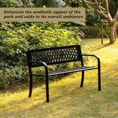 a park bench sitting in the grass next to some bushes and trees with a quote about enhances the aesthetic appeal of the park and adds to its overall ambiance