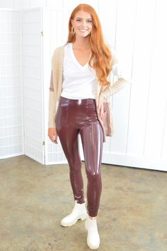 L. Mae's Spanx Faux Patent Ruby Leather Leggings are our go-to staple bottoms this fall and winter season! Featuring a snug glossy faux leather material and shaping waistband, these burgundy leggings are extra comfortable and can turn your outfit up a notch! Pair them with your favorite top and some booties for an on-trend look. Features: Model wearing size M If in between sizes, size up! Shiny faux leather material Skinny fit leggings Holiday/Christmas party Leather Leggings Outfits, Faux Patent Leather Leggings, Lederhosen Outfit, Patent Leather Leggings, Leather Leggings Outfit, Leggings Outfits, Black Leather Leggings, Burgundy Leggings, Cute Dress Outfits