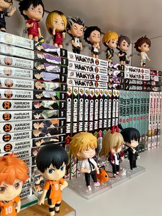 many anime figurines on display in a store