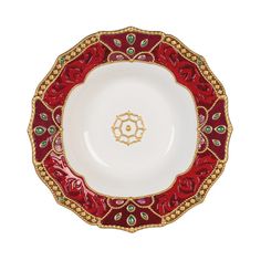 a red and white plate with gold trim