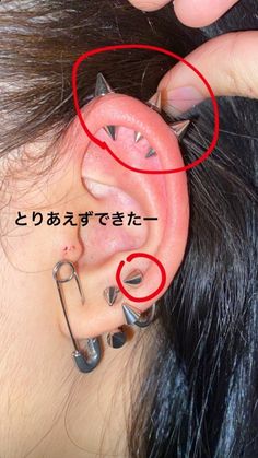 an ear piercing is shown with the word'o'written in japanese on it