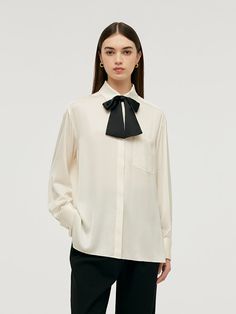 -22 Momme mulberry silk -With necktie -Soft and comfortable This blouse is crafted from 22 momme mulberry silk, ensuring both softness and comfort. It features a stylish necktie that can be styled in various ways, such as a bow tie, straight tie, or flowing ribbon, adding a versatile and fashionable touch. The designer's personal favorite, it blends functionality with a unique style statement.22 Momme Mulberry Silk Women Blouse With NecktieGoodsNo: 1C8L3E100• Fit Type: Loose• Elastic: Micro-elas Working Clothes, Mulberry Silk Fabric, Women Blouse, Long Sleeve Short Dress, Style Statement, Knitted Tank Top, Black White Red, Cheongsam, Knit Tanks