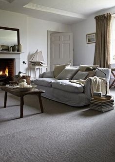 a living room filled with furniture and a fire place