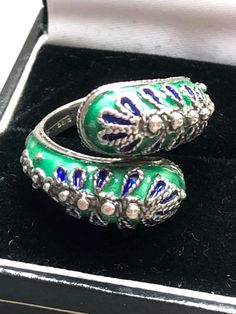 This is so lovely !!  Boxed two head snake ring in 925 silver with blue and green enamel detail Size M.5 6.7g boxed Very pretty and unusual marked 925, silver ring.   In such a beautiful design Super condition.  Never worn! I am currently selling some beautiful vintage jewellery  Please do have a look at my other jewellery listings  Happy to combine postage for multiple purchases Two Headed Snake, Two Heads, Snake Design, Statement Ring Silver, Snake Ring, Green Enamel, Green And Blue, Vintage Jewellery, Statement Ring