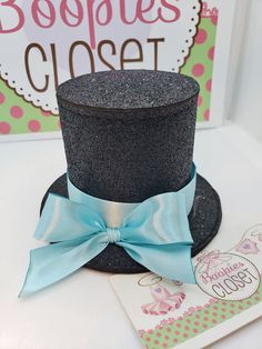 "THIS IS A MINI HAT DESCRIPTION:  This Oversized (for a Mini Hat that is) Top Hat is a miniature top hat that we  use as a base for your unique design or idea.  We make this hat ITH - in the hoop of our embroidery machine using Felt or Sparkle Foam. Then we add a satin ribbon in the color of your choice.  This creation would be great for any event to give your outfit a special accessory. HAT SIZE:  Approx. 5\" round with brim and 4\" tall HAT FABRIC OPTIONS: Sparkle or No sparkle (felt) HAT COLOR: Changeable RIBBON COLORS: Changeable PERSONALIZATION: When you checkout put the following in the notes section; Hat color, Sparkle or No sparkle, Ribbon Color. MOUNTING OPTIONS: Available mounting options are Alligator Clip, Elastic Headband and Hard Headband.  Elastic Circumferences: Elastic Bab Adjustable Whimsical Mini Hats For Costumes, Whimsical Adjustable Mini Hats For Carnival, Adjustable Novelty Mini Hat For Cosplay, Tiny Top Hat, Mini Top Hat Headband, Baseball Cap Hairstyles, Mini Cowboy Hat, Mardi Gras Hats, Tall Hat