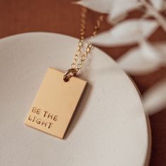 A unique way to personalize your pendant and make a statement! Our Luna rectangle necklace is 1/2" x 3/4". Pendant can fit up to 4 lines of texts and 6 letters for each line. Or one line of text and symbol (rainbow, mountain, bloom flowers, monstera leaf, succulent, baby footprints or sunshine) •D E T A I L S• -Available in 14k gold filled + sterling silver -Chain length 16", 18", 20", 24" -Cable chain and spring clasp included GIVING THIS AS A GIFT? Your jewelry will arrive to you in one of our Everyday Personalized Rectangular Necklace, Personalized Rectangular Pendant Charm Necklace, Minimalist Hand Stamped Rectangular Pendant Necklace, Rectangular Adjustable Charm Necklaces For Gifts, Meaningful Gift Necklace, Meaningful Rectangular Necklaces For Gifts, Meaningful Rectangular Necklace For Gift, Minimalist Personalized Rectangular Jewelry, Gold Rectangular Hand Stamped Jewelry