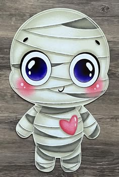 a paper cut out of a cartoon character with big eyes and a bandaged face