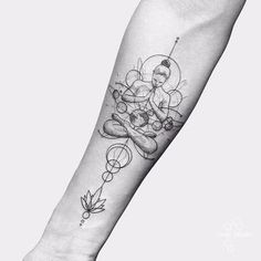 a person with a tattoo on their arm is holding a small flower and an object