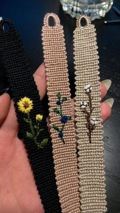 two handmade bracelets with flowers on them