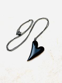 Heart Necklace ~ Black Enamel Minimalist Goth Heart Pendant Necklace Black enamel fused to copper heart. The heart measures 1 inch in height. Includes 18 inch patinated Sterling silver Italian chain. Perfect for The one you love. Handle as glass. Handmade in the Pacific Northwest. 🖤 Handmade Black Heart Pendant Necklace, Black Heart Pendant Edgy Jewelry, Black Enamel Heart Pendant Jewelry, Black Heart-shaped Metal Chain Necklace, Gothic Black Heart Pendant Necklace, Copper Heart, Enamel Necklaces, Black Heart, Heart Pendant Necklace