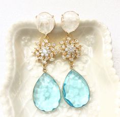 Please sample order one pair before making your bridesmaids purchase if you are unsure on style, length, color or finish. You are welcome to return one pair. I usually ship the single pairs out very quickly. Please contact me if you are in hurry, I can accommodate rush orders.Aquamarine White Quartz Earrings, Aqua Wedding Jewelry, Special Ocassion Light Blue Earrings, Bridal Formal Sparkle Crystal Long Earrings White Rock Crystal prong settings drop elegant CZ crystal flower bursts and gorgeous Aquamarine Wedding Earrings, Wedding Aquamarine Jewelry, Aqua Wedding Colors, Blue Earrings Wedding, Light Blue Earrings, Blue And White Earrings, Aquamarine Wedding, Aqua Jewelry, 2nd Wedding