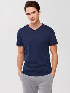 Also known as the Georgia V-neck T-shirt. It is the equally comfortable and stylish brother of The Barakett Tee. Made with our exclusive Georgia fabric with Soft Water finishing, it’s the ultimate in comfort, luxurious hand feel, and clean appearance. A versatile piece in any man’s wardrobe; elevate any look with the most comfortable V-neck ever. 100% USA grown Pima cotton Color retention up to 50 washes Shape retention engineering Classic Navy V-neck Top, Blue Cotton V-neck T-shirt, Navy Casual V-neck T-shirt, Soft Water, Natural Fabrics, Pima Cotton, Online Purchase, White Undershirt, V Neck T Shirt