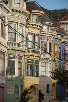 many multicolored houses line the street in san francisco