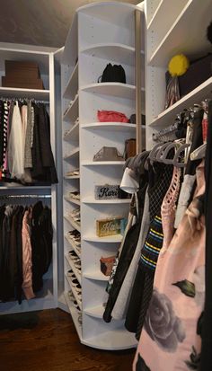 the closet is full of clothes and other things to wear in it's storage area