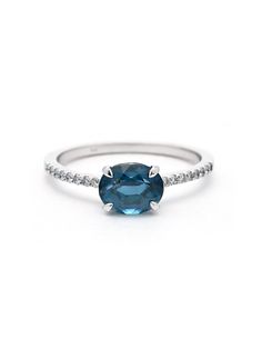 1.72 Ct. Green-blue oval Sapphire, and .10 Ct Groove set White Diamonds in a 14K White Gold Ring. On hand in Size 6.5, please contact us for other sizes. Oval Blue Topaz Diamond Ring With Brilliant Cut, Oval Blue Topaz Ring In 14k White Gold, Oval Blue Ring In 14k White Gold, Oval Blue Diamond Ring In 14k White Gold, Oval Brilliant Cut Topaz Ring, Oval Blue Topaz Diamond Ring, Oval Blue Topaz Diamond Ring With Prong Setting, Blue Oval Diamond Ring With Prong Setting, Blue Oval Diamond Ring