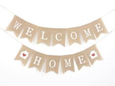 the welcome home banner is hanging from a string