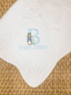 Beautiful Personalized Heirloom Baby Quilt. This timeless keepsake would make a perfect baby shower gift or a gift for a new mama once baby has arrived. The covering is made of 100% cotton and the filling is 60% cotton and 40% polyester. It is ultra soft, hypo-allergenic and light weight. It measures 46 inches by 36 inches. The edge is scalloped with a beautiful embossed pattern on the quilt. It is available in 5 different color options. The embroidery for this quilt includes a single letter mon Monogram Baby Blanket, Personalized Baby Shower Gifts, New Mama, Heirloom Quilt, Personalized Bunny, Quilted Gifts, Embossed Pattern, Personalized Baby Blanket, Quilt Baby