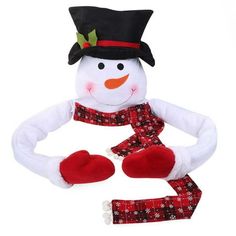 a snowman wearing a hat, scarf and mittens