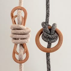 there are two ropes that have rings on them and one is knoted with rope