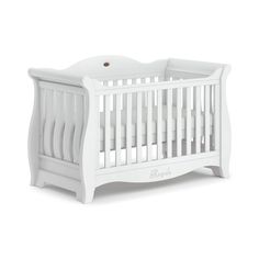 a white baby crib with the word bebe written on it's side