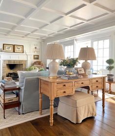 a living room filled with furniture and a fire place