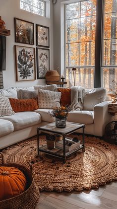 a living room filled with furniture and lots of windows