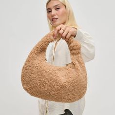 Get ready to show off your style with our new Sherpa Bag! With a playful knot detail and gold chain, this fuzzy winter bag is the perfect addition to your collection. Pair it with your fall looks and make a statement wherever you go. So trendy & cute for the season! Winter Bags, Beaded Cuff, Leather Hobo Bag, Dainty Bracelets, Trending Gifts, Cuff Earrings, Stylish Bag, Casual Street Style, Leather Hobo