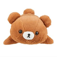 a brown teddy bear with black eyes laying down