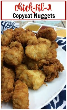 fried chicken nuggets on a white plate with dipping sauce